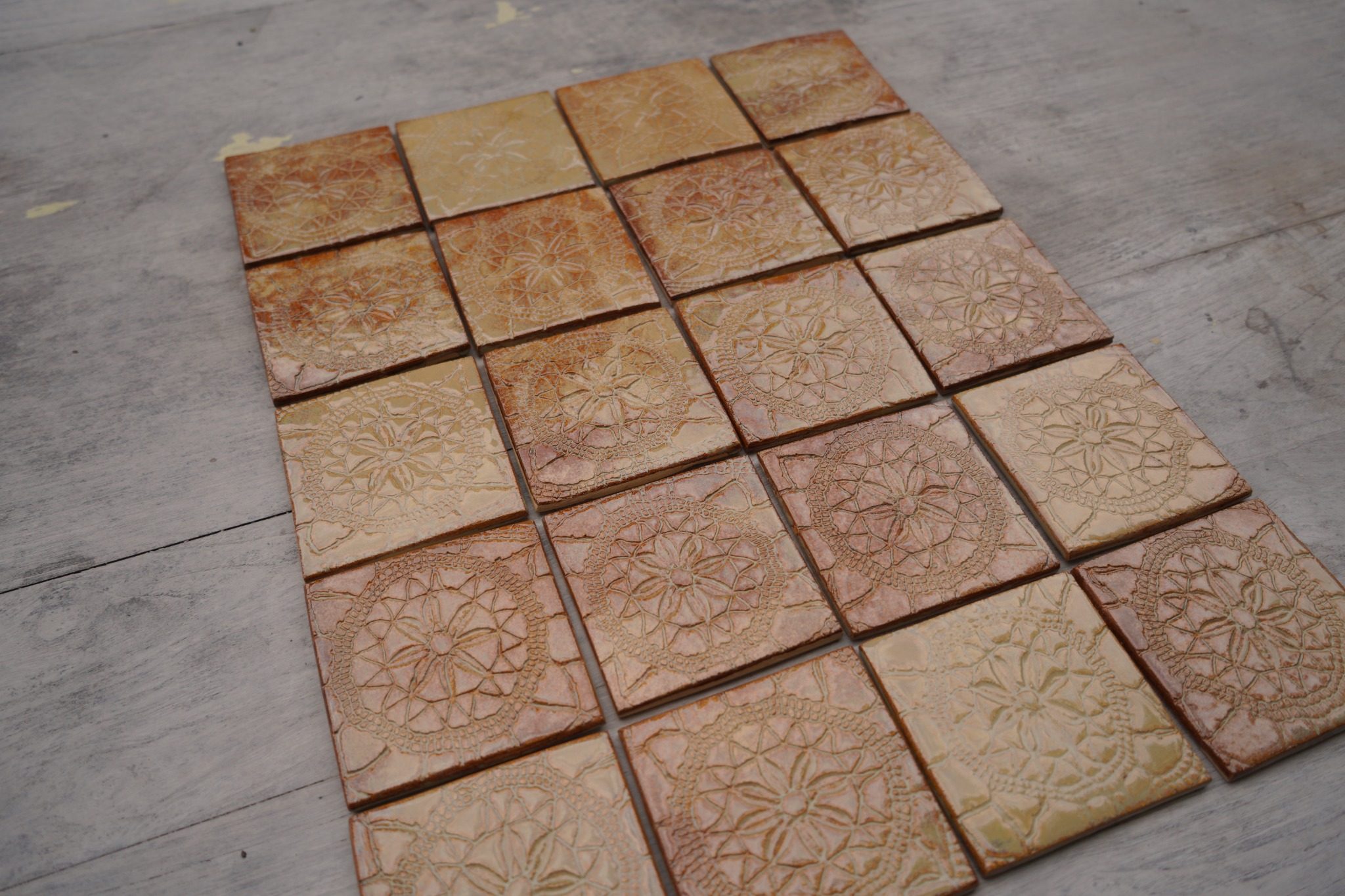 Close view of warm Flemish Relief Rutile tiles with handmade surface variation.